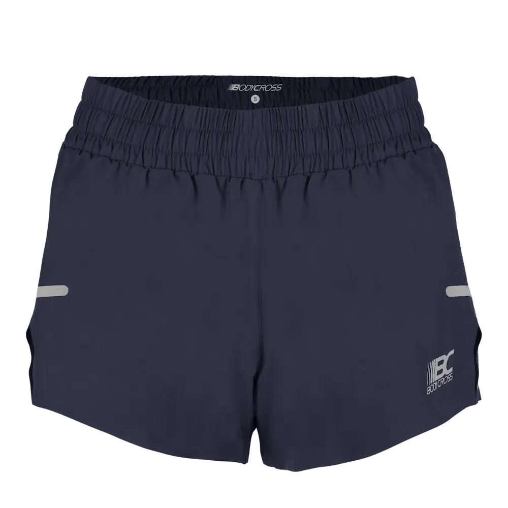 Short running trail femme BODYCROSS Alix noir vue de face avec large ceinture élastiquée, logo blanc et détails réfléchissants