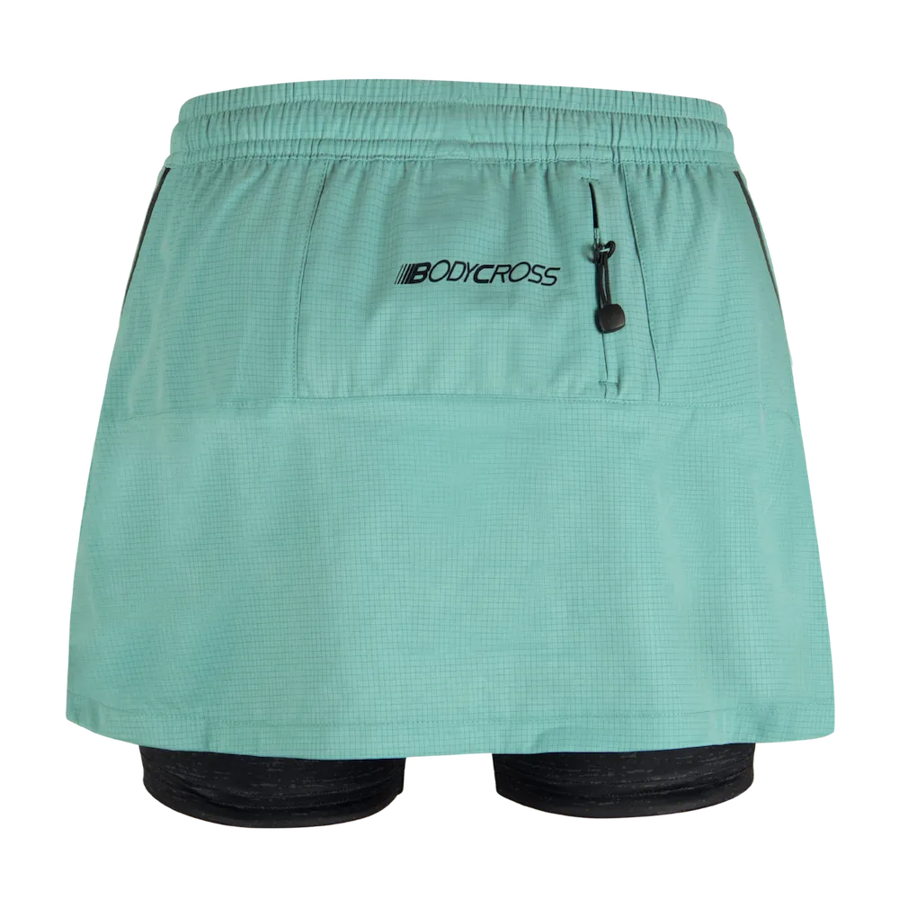 Short-jupe running trail femme BODYCROSS Angy vert vue arrière avec poche zippée