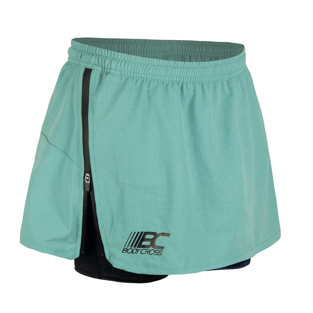 Short-jupe running trail femme BODYCROSS Angy vert vue avant avec zip latéral