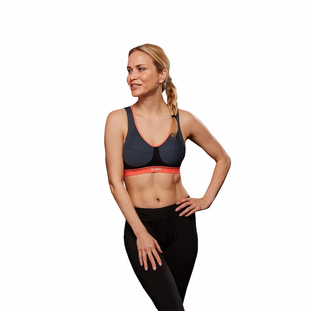Brassière Activ Sport Bra Thuasne Sport gris et corail portée par une femme, vue de face