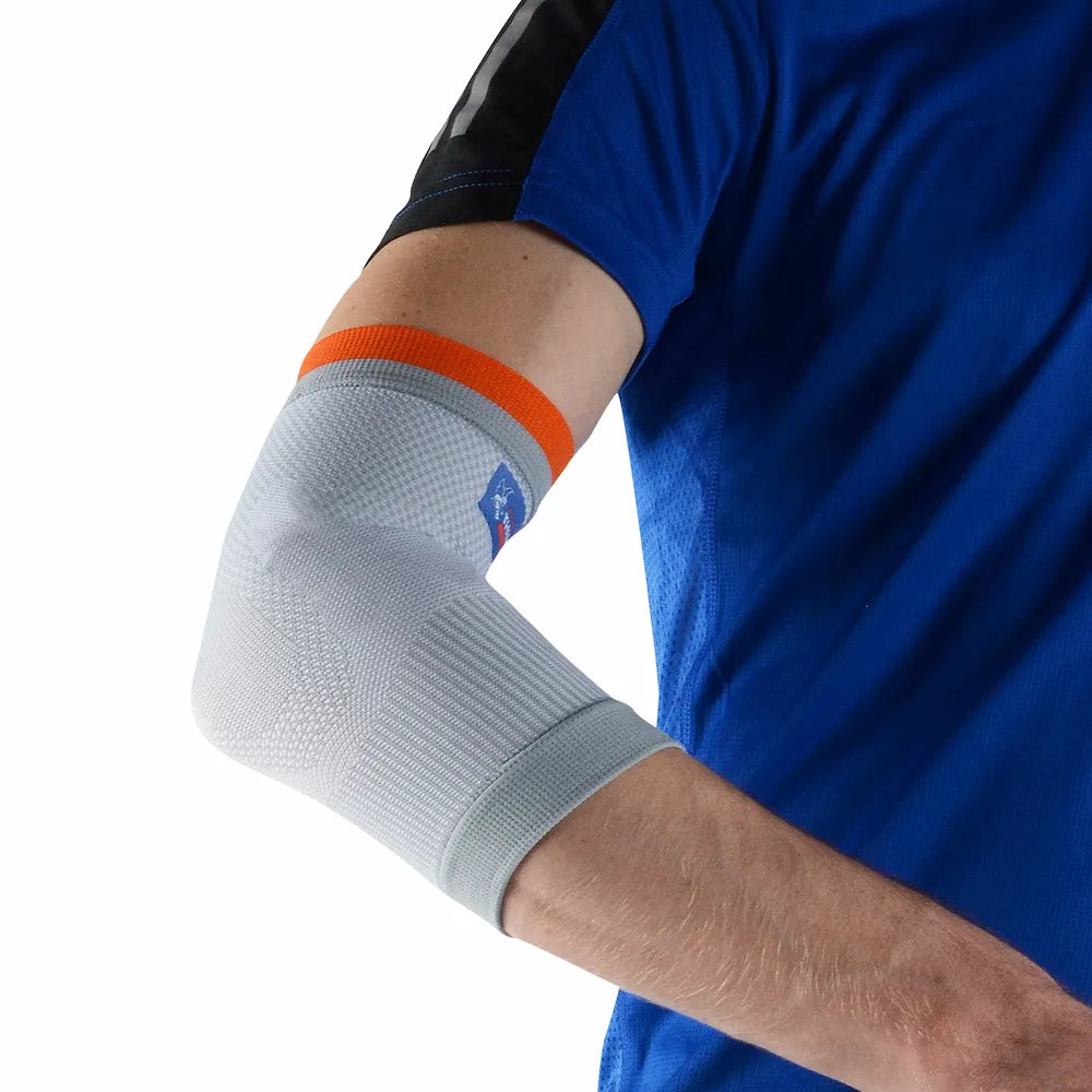 Coudière de maintien Thuasne Sport Stabilité 2 portée, vue du coude avec différentes zones de tricot